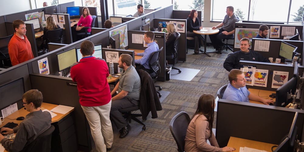 Wide shot of employees working on a sales floor
